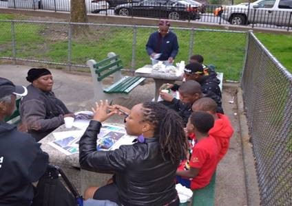Images/Events/2021/08_August/ie1.jpg black women and children chatting in a park