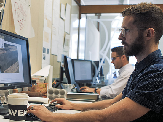guy working on a sketching program on computer