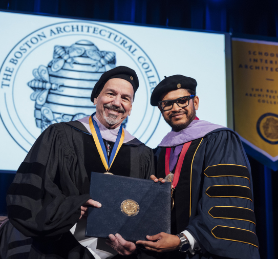 Jim Ansara receives his honorary degree from BAC President Mahesh Daas at the 2025 Commencement Ceremony.