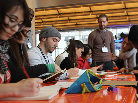 students sketching in a group